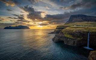 Картинка природа, закат, океан, скалы, водопад, острова, пейзаж, горы, облака, мир