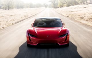 Картинка Красный автомобиль Tesla Roadster на трассе, вид спереди
