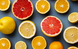 Обои Лимоны, грепфрукты и апельсины на сером фоне