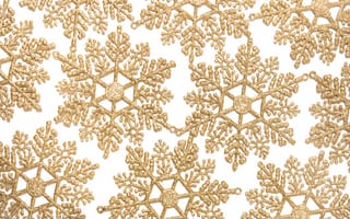 Картинка Золотистые снежинки на бежевом фоне
