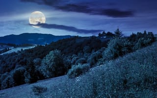 Картинка Большая луна в ночном небе над холмами