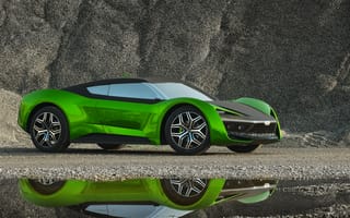 Картинка Зеленый автомобиль GFG Vision 2020 года отражается в луже