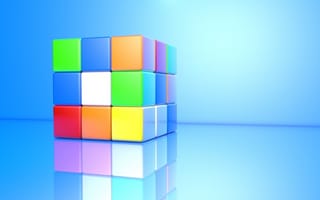Картинка Разноцветный кубик Рубика на голубом фоне 3д графика