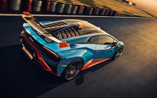 Обои Быстрый автомобиль Lamborghini Huracán STO 2021 года на гоночной трассе