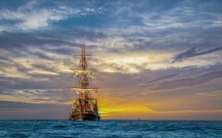 Картинка Большой пиратский корабль в море на закате