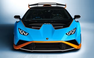 Картинка Голубой автомобиль Lamborghini Huracán STO 2021 года вид спереди на сером фоне