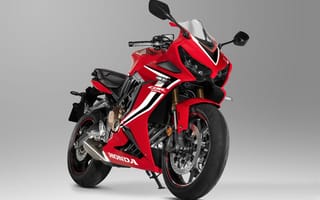 Картинка Красный мотоцикл Honda CBR 650 RR, 2021 года на сером фоне