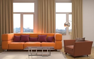 Картинка Большой оранжевый диван с подушками у окна